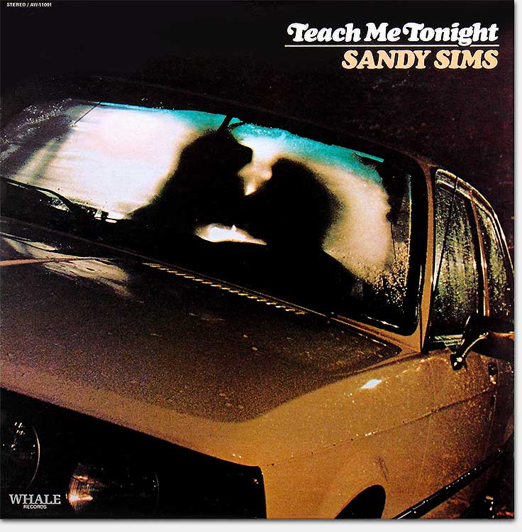 Record album cover for the tax shelter record credited to Sandy Sims, 'Teach Me Tonight,' Whale Records, Bowen Arrow Productions, Album World, a division of International Record Distributing Associates. From the designer's website: https://www.ericwrobbel.com/art/teachmetonight.htm