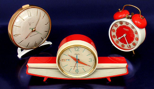 Vintage wind-up 'Clock of Tomorrow' by Westclox (1955, USA). In the center, a delightful clock that reminds me of a 1950s Chevrolet emblem. It's a wind-up Rhythm 'Auto Calendar Alarm Clock' (c.1958, Japan). At right is the fun Blessing wind-up alarm clock from West Germany, c.1960. From 'A Collection of Clocks' at the web's largest private collection of antiques & collectibles: https://www.ericwrobbel.com/collections/clocks.htm