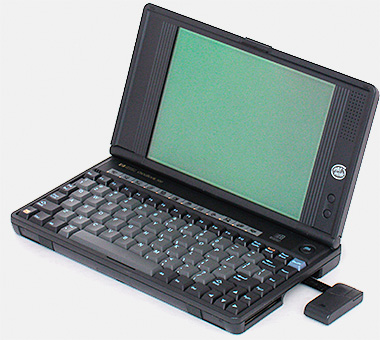 In the 1990s we entered the all-computers-have-to-be-black phase. One standout was this Hewlett-Packard OmniBook 300. It had a little mouse that came out the side on a tether. At its introduction in 1993, according to HP, this was the smallest and lightest PC on the market to feature a full-size keyboard and full VGA (9-inch monochrome) screen. From 'Small Computers' at the web's largest private collection of antiques & collectibles: https://www.ericwrobbel.com/collections/computers.htm
