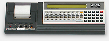 Collecting vintage computers: Radio Shack's 1980 TRS-80 (Japan) pocket computer with 'Printer Cassette Interface.' The computer itself measures just 6-7/8 by 2-3/4 by 5/8 inches. The printer writes to paper tape only 1-3/4 inches wide, like a calculator. From 'Small Computers' at the web's largest private collection of antiques & collectibles: https://www.ericwrobbel.com/collections/computers.htm