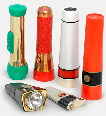Collectible flashlights Ray-O-Vac, Eveready, AFC. Flashlights are one collectible you can actually use. Most take standard batteries and use standard bulbs still commonly available. The rechargeable flashlights lying down here don't use standard batteries. The 'Super 200' and 'Galaxy' by Gulton pull apart and plug directly into wall socket for charging. From 'Flashlights' at the web's largest private collection of antiques & collectibles: https://www.ericwrobbel.com/collections/flashlights.htm