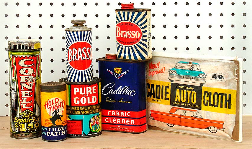Vintage garage collectibles: Cornell Tube Repair Kit (Akron, 1940s), Hold Tight! tube patch kit (Better Monkey Grip Co., Dallas, c.1955), Brasso (Hull & London, England, 1960s), Pure Gold grease (Pep Boys, Philadelphia, c.1960), Brasso c.1960, Cadillac Fabric Cleaner with chlorothene (General Motors, Detroit, c.1959), Cadie Auto Cloth, c.1960. From 'Garage/Utility Collectibles' at the web's largest private collection of antiques & collectibles: https://www.ericwrobbel.com/collections/garage.htm
