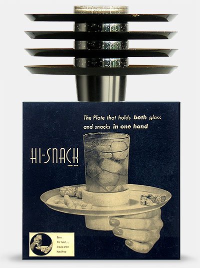 Vintage 'Hi-Snack Plates'--stackable plates with drink holder. 'The plates that hold both glass and snacks in one hand.' Shown stacked on top of their original box is how they look best. Individually they're not so great, especially abandoned, smeared with dip, and tipped over on your piano. From 'More Kitchen Collectibles' at the web's largest private collection of antiques & collectibles: https://www.ericwrobbel.com/collections/kitchen-2.htm