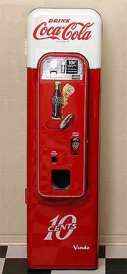 Vendo 44 Coca-Cola vending machine model 44. Most Coke machines are huge and would be out of place in most home settings. But this little guy fits right in, even in a kitchen. From 'Collecting: A Rationale' at the web's largest private collection of antiques & collectibles: https://www.ericwrobbel.com/collections/rationale-2.htm