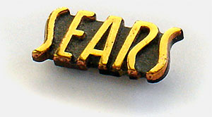 Collectible pin from Sears Roebuck & Co. Probably an employee pin c.1940. From 'Collecting: A Rationale' at the web's largest private collection of antiques & collectibles: https://www.ericwrobbel.com/collections/rationale-2.htm