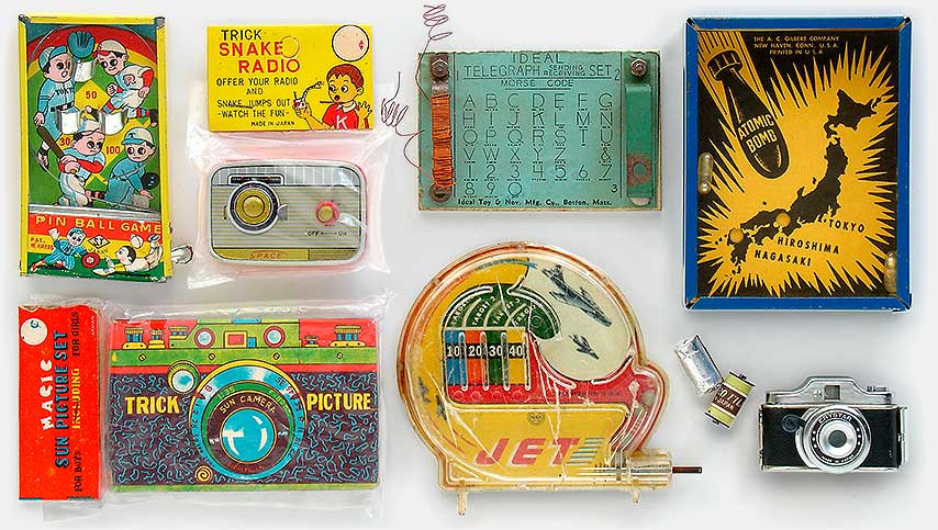 Vintage toys: Pin Ball Game, Trick Snake Radio, Ideal Telegraph Sending Receving Set (try and imagine a child sending morse code to a friend with this--just like texting!), Gilbert Atomic Bomb Game (the point is to move the thing around until the little weighted 'bombs' rest in their intended targets, Hiroshima and Nagasaki), Magic Sun Picture Set, Jet, Crystar toy camera. From 'More Toys' at the web's largest private collection of antiques & collectibles: https://www.ericwrobbel.com/collections