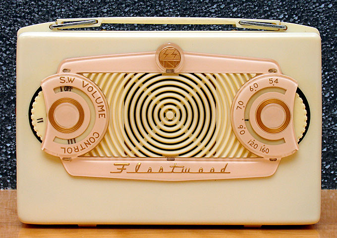Before the transistor, electronics devices had vacuum tubes. This Fleetwood NR-260, measuring 8 inches across, is a mid-late 1950s example of one of the last tube radios, made in Japan during the early transistor era. Note the attractive 'underpainted' plastic trim around the knobs and logos. From 'Tubes and Transistors' at the web's largest private collection of antiques & collectibles: https://www.ericwrobbel.com/collections/tubes-transistors.htm