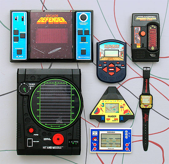 Collectible video games: Arcade Defender by Entex (1981), Milton Bradley Hangman (LCD, 1995), Mattel Battlestar Gallactica Space Alert from 1978. The large one is Tomy's Hit and Missile from 1979. The last three are LCD games: Invader, c.1980s, the Nintendo 'Game and Watch' Manhole from 1983, and in the shape of an actual watch, Nintendo's Zelda from 1989. From 'Early Video Games' at the web's largest private collection of antiques & collectibles: https://www.ericwrobbel.com/collections