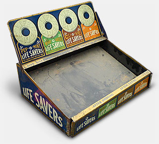 Life Savers counter display offers only four flavors - the first four original flavors - all great! Pep-O-Mint, Wint-O-Green, Cl-O-ve, and Lic-O-rice. Clove and licorice may have disappeared from the popular taste but not from mine! This display dates from 1913-1919. From 'More of The Way Things Were' at the web's largest private collection of antiques & collectibles: https://www.ericwrobbel.com/collections/way-things-were-2.htm